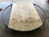 Image of Round wooden table with Maverick Nex-Level Floor Base on a concrete floor